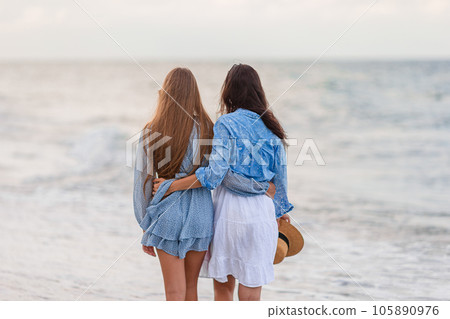 Beautiful mother and daughter at Carribean beach enjoying summer vacation Beautiful mother and daughter at Carribean beach enjoying summer vacation 105890976