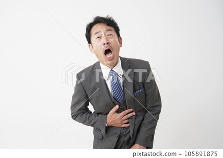 Middle-aged businessman with abdominal pain White background Middle-aged businessman with abdominal pain White background 105891875