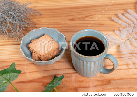 Served with coffee and biscuits, ferns and vines 105893800