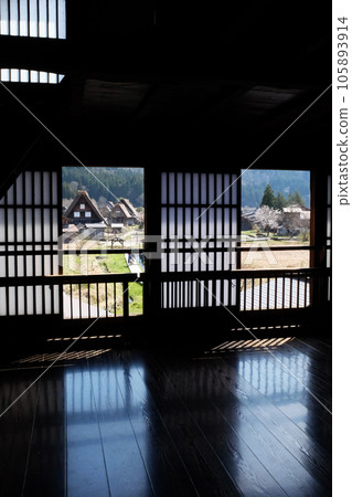 Gassho-style houses in Shirakawa-go in spring seen from the window 105893914