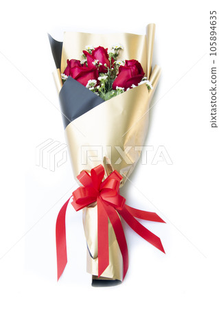 Rose bouquet wrapped in golden paper Rose bouquet wrapped in golden paper 105894635