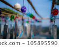 Wishes and swaying wind chimes 105895590