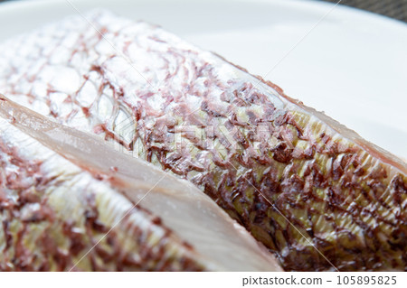 A close-up of the skin of a red sea bream fillet. 105895825