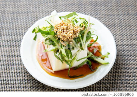 Chilled tofu with plenty of cucumbers and potherbs (myoga and perilla). 105896906