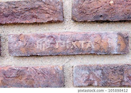 Brick wall background texture of old material 105898412