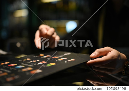 Waitress recommend something special to customer in restaurant Waitress recommend something special to customer in restaurant 105898496