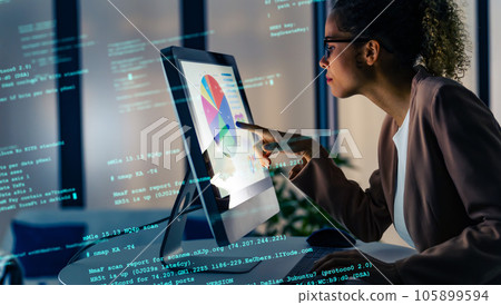 Woman working in office and digital data image 105899594