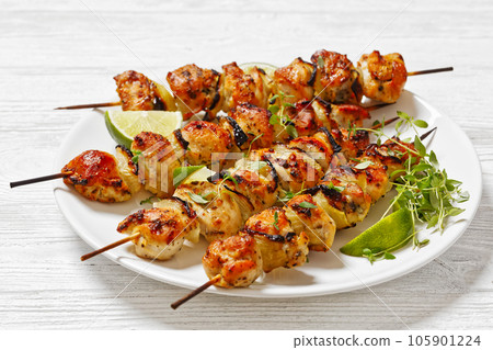 chicken souvlaki with thyme and lime on plate 105901224