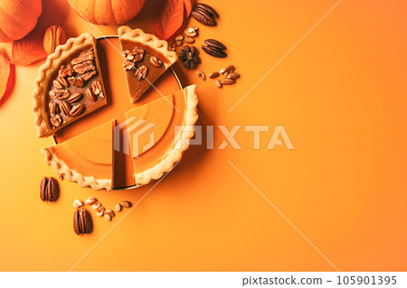 Festive homemade appetizing ripe pumpkin pie, minimalistic orange background, seasonal fall baking Festive homemade appetizing ripe pumpkin pie, minimalistic orange background, seasonal fall baking 105901395
