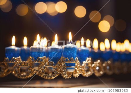 Close-up of a beautifully lit Hanukkah menorah. Hanukkah decoration with candles 105903983