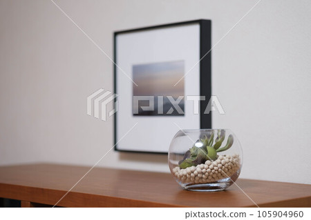 A vase to decorate on the living board. light and its shadow. Display your own photos inside. Access to a calm living room A vase to decorate on the living board. light and its shadow. Display your own photos inside. Access to a calm living room 105904960