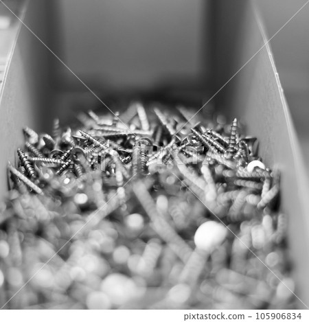 Silver grey self-tapping screws as industrial background. Close up. Silver grey self-tapping screws as industrial background. Close up. 105906834