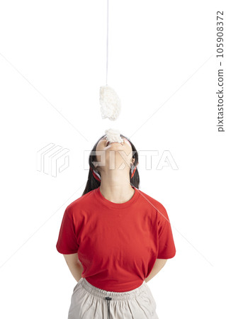 Indonesian girl celebrate Indonesian independence day on 17 August with crackers eating competition Indonesian girl celebrate Indonesian independence day on 17 August with crackers eating competition 105908372