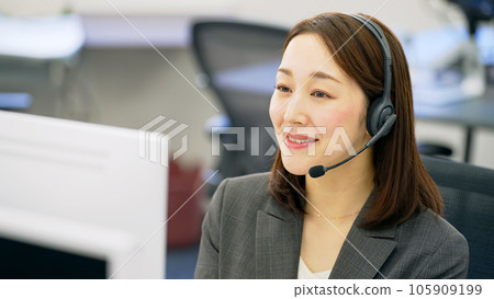 Female operator working in the office Female operator working in the office 105909199