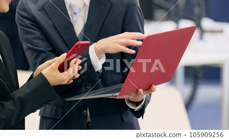 Group of business people having a conversation in the office Group of business people having a conversation in the office 105909256