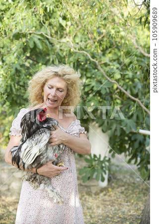 woman with rooster 105909689