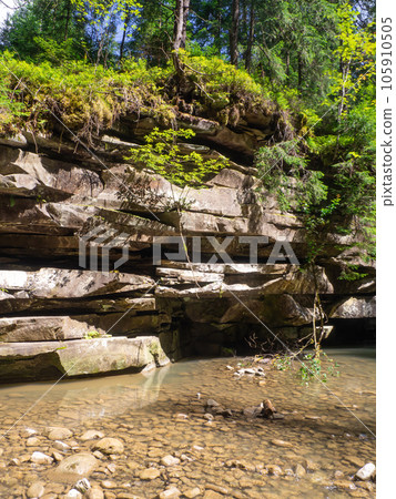 mountain layers of stones covered with grass mountain layers of stones covered with grass 105910505