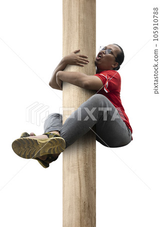 Indonesian men celebrate Indonesian independence day on 17 August with a climb competition 105910788