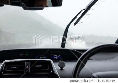 View from a car driving on a highway on a rainy day 105910846