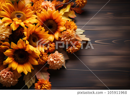Autumn bouquet of sunflowers on a wooden background 105911968