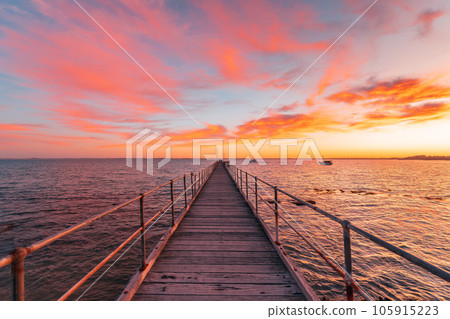 Robe jetty with fishermen during sunrise, South Australia 105915223