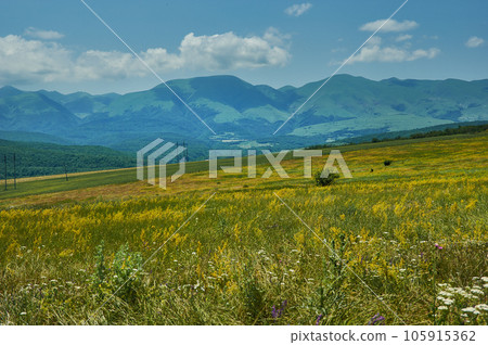 Scenic view of green meadows big mountain Dagestan Scenic view of green meadows big mountain Dagestan 105915362