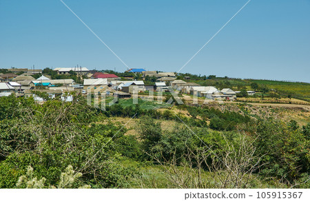 Scenic view of green meadows big mountain Dagestan Scenic view of green meadows big mountain Dagestan 105915367