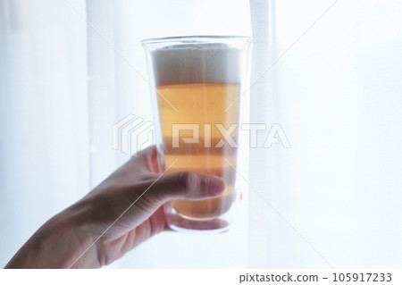 hand with beer glass hand with beer glass 105917233