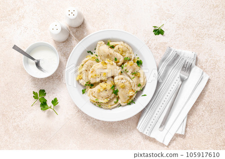 Homemade pierogi, dumplings, varenyky or vareniki with cabbage, top view 105917610