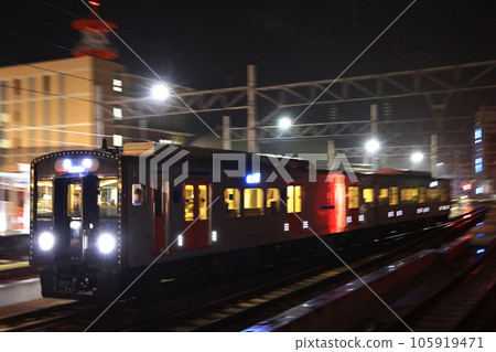 Nagasaki Station at night, the new YC1 hybrid railcar enters the line carrying people Nagasaki Station at night, the new YC1 hybrid railcar enters the line carrying people 105919471
