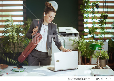 smiling modern small business owner woman at work smiling modern small business owner woman at work 105919592