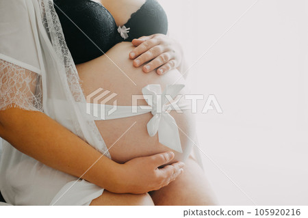 Young pregnant woman with belly, pregnancy concept 105920216