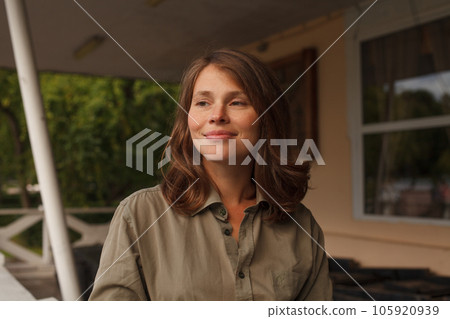 Pretty cheerful woman enjoying summer nature outdoor 105920939