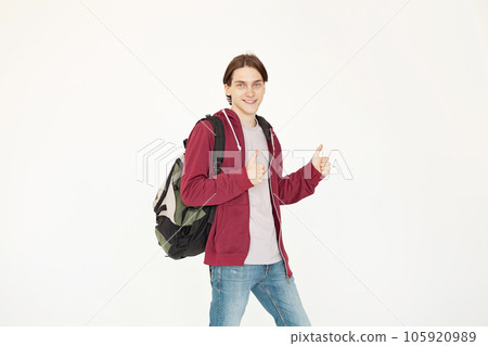Happy man student standing holding thumb up isolated on white background 105920989