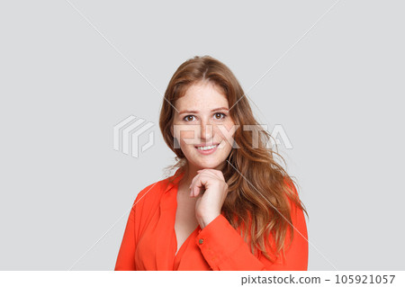 Beautiful friendly woman smiling on white background 105921057