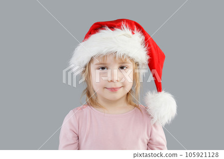 Christmas child baby girl Santa on gray background, Christmas portrait Christmas child baby girl Santa on gray background, Christmas portrait 105921128