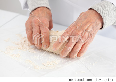 kneading by hand. Home made pizza dough preparation. Pizza preparation. 105922183