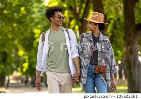 Cute couple spending time together in the park and looking happy 105922561