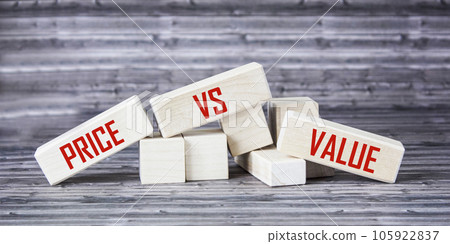 Wooden blocks with Price vs Value inscription on wooden background 105922837
