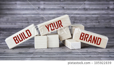 conceptual image, word BUILD YOUR BRAND on wooden blocks and wooden table. 105922839