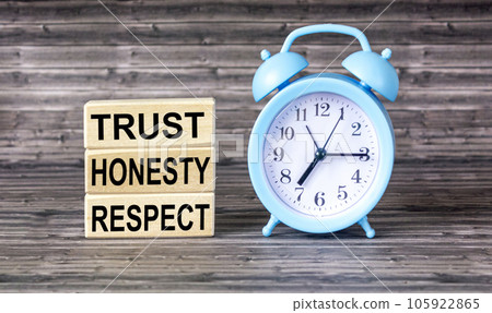 Wooden blocks with the words TRUST, HONESTY, RESPECT, on a wooden background. Wooden blocks with the words TRUST, HONESTY, RESPECT, on a wooden background. 105922865