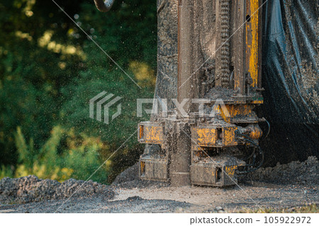 Close up of well drilling rig boring dowin into the earth. 105922972