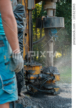 Close up of well drilling rig boring dowin into the earth. Close up of well drilling rig boring dowin into the earth. 105923043