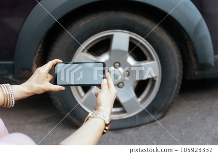 Closeup on woman in city taking photo with smartphone Closeup on woman in city taking photo with smartphone 105923332