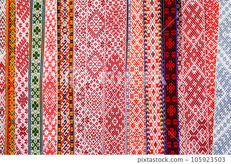 Traditional colorful handmade woven Baltic national patterned fabric belts background Traditional colorful handmade woven Baltic national patterned fabric belts background 105923503