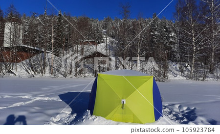 ice fishing in the North of Sweden sunrise in a beautiful day ice fishing in the North of Sweden sunrise in a beautiful day 105923784