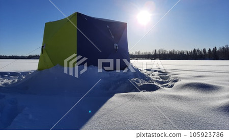 ice fishing in the North of Sweden sunrise in a beautiful day 105923786