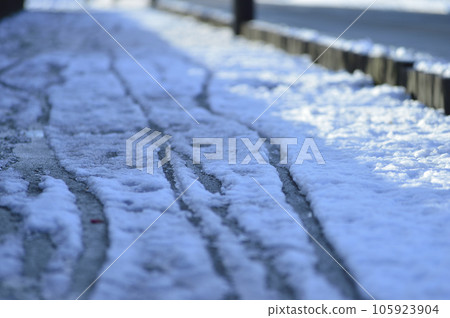 Snow and sidewalk Snow and sidewalk 105923904