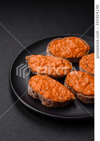 Delicious sandwich consisting of toast, red sauce with salt, spices and herbs Delicious sandwich consisting of toast, red sauce with salt, spices and herbs 105924140