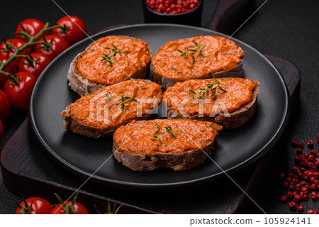 Delicious sandwich consisting of toast, red sauce with salt, spices and herbs Delicious sandwich consisting of toast, red sauce with salt, spices and herbs 105924141